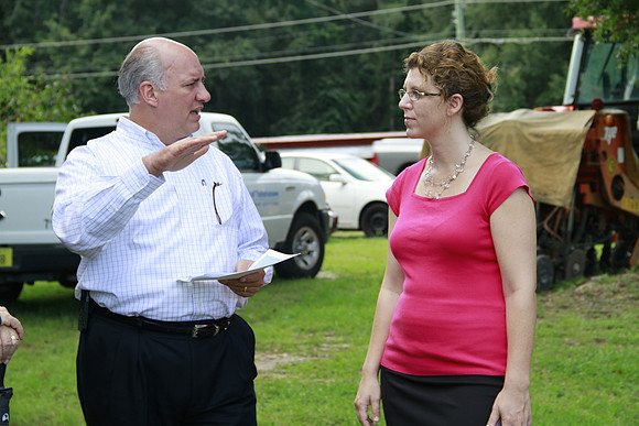 Congressman Southerland and Commissioner Dozier observe and discuss the National Veteran Cemetery Site.