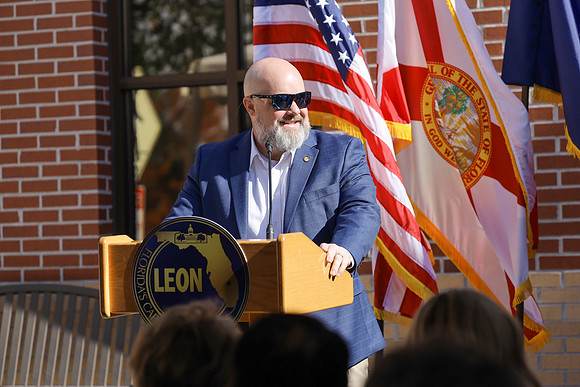 Commissioner Welch provides remarks at the dedication of the Bruce J. Host Northeast Branch Library.