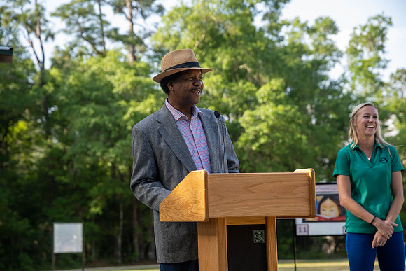 Commissioner Proctor provides remarks at the opening of the Fort Braden History Walk.