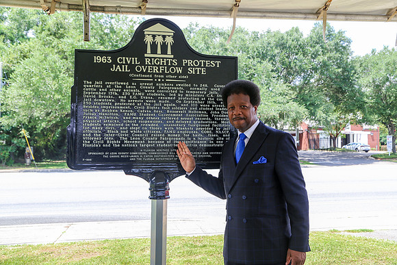 Commissioner Proctor stands with the 1963 Civil Rights Protest Jail Overflow Site history marker at the North Florida Fairgrounds, honoring the sacrifices of hundreds of students made during the Civil