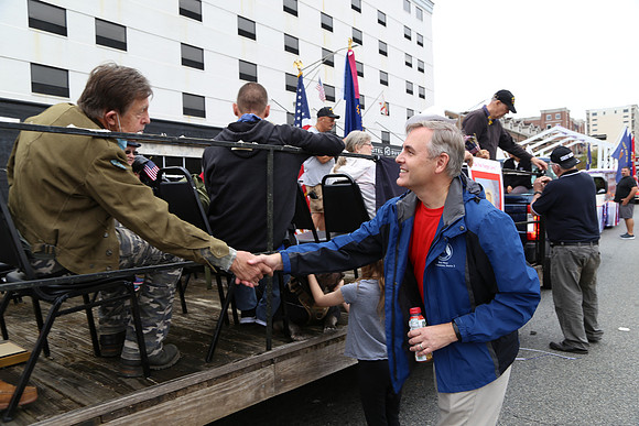 Commissioner Minor shakes a veteran's hand at the Tallahassee Veteran's Day Parade.