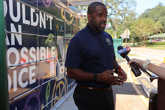 Commissioner Maddox answers questions from the media on the Sabal Palm Elementary Food Lockers unveiling in partnership with Second Harvest of the Big Bend